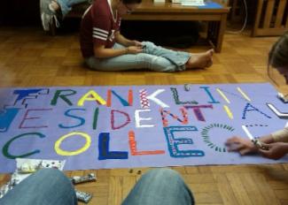 Students decorating FRC welcome sign