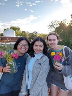 3 FRC members with harvested Zinnia flowers