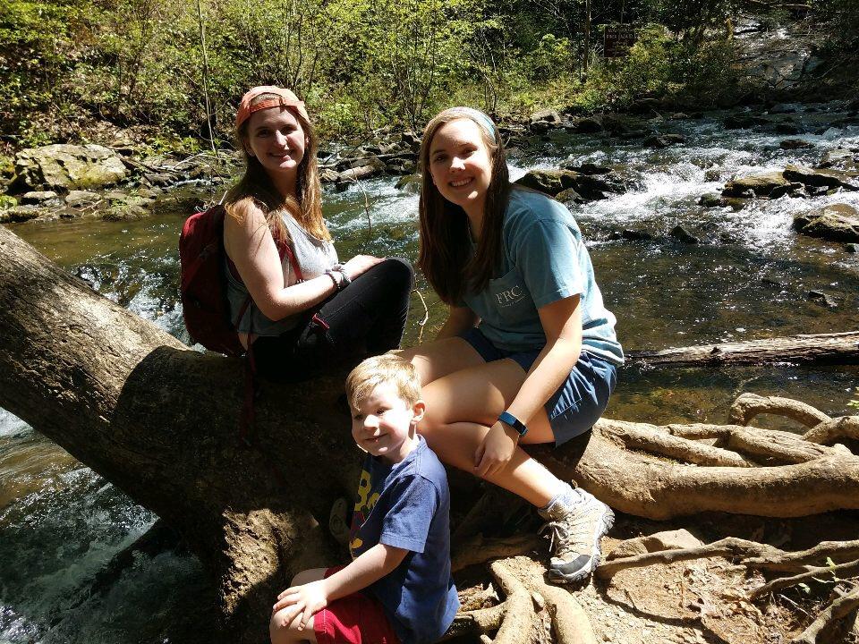 Courtney, Janna, and Cooper below the falls